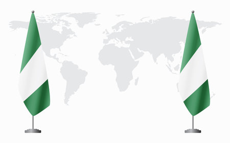Nigerian and Nigeria flags for official meeting against background of world map.のイラスト素材