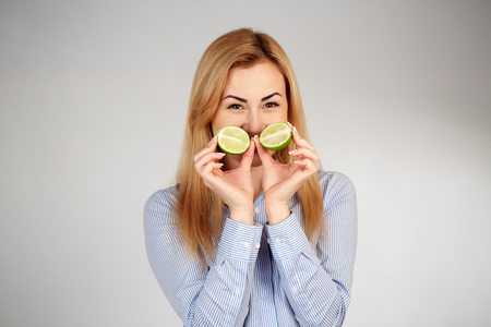 Healthy girl in diferent emotions, with limeの写真素材