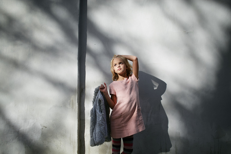Teen beautiful girl poses outside in fashion styleの写真素材