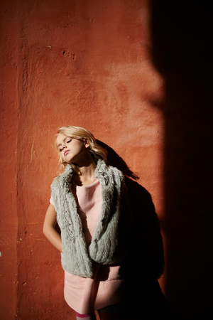 Teen beautiful girl poses outside in fashion styleの写真素材