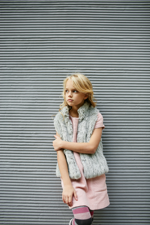 Teen beautiful girl poses outside in fashion styleの写真素材