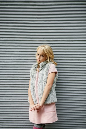 Teen beautiful girl poses outside in fashion styleの写真素材