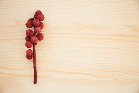 Christmas frame: cones, cinnamon, berries, acorn on the wood tableの写真素材