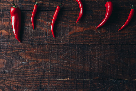 chili peppers on a wooden backgroundの写真素材