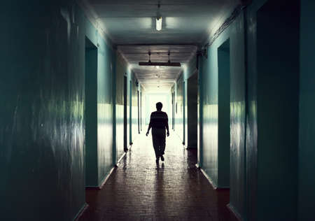 silhouette in a corridor. Light at the end of the tunnel conceptの写真素材
