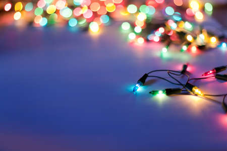 Christmas lights on dark blue background with copy space. Decorative garland Christmas lights on dark blue background with copy space. Decorative garland