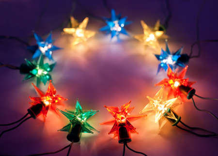 Christmas lights in ring on dark background with copy space.Decorative garland の写真素材
