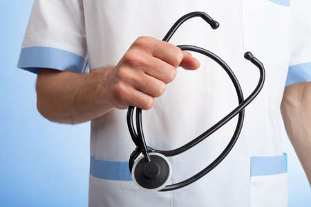 Stethoscope in hands of medical doctor  の写真素材