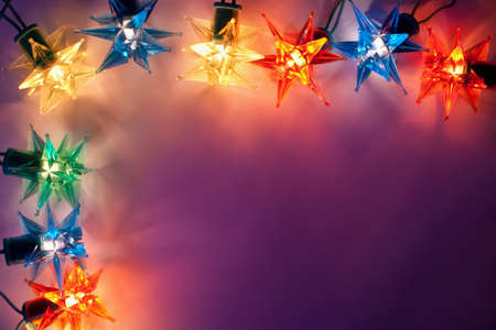 Christmas lights frame on dark background with copy space.Decorative garland の写真素材