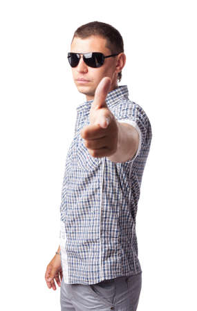  young man in sunglasses shows forefingers isolated on white background の写真素材