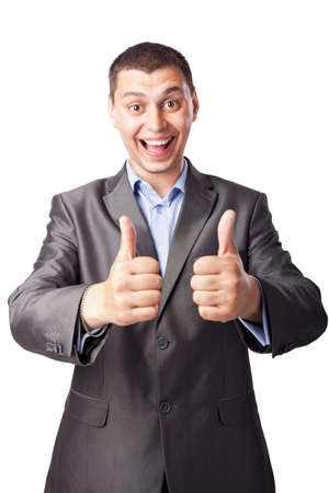 smiling happy young businessman hands make thumbs up isolated on white background の写真素材