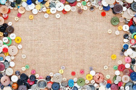 Buttons frame on fabric texture background