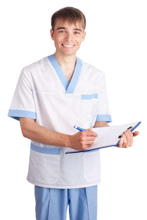 young smiling medical doctor with clipboard isolated on white backgroundの写真素材