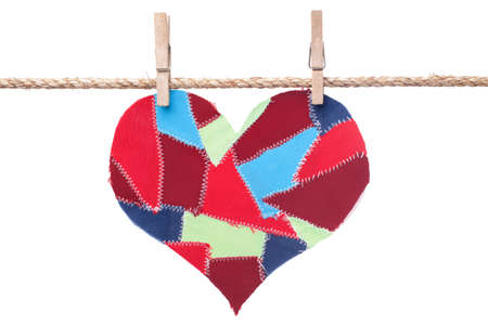  fabric scraps heart hanging on the clothesline. Isolated on white. Valentine's Day の写真素材