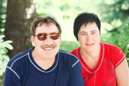 portrait of a cute aged couple at nature の写真素材
