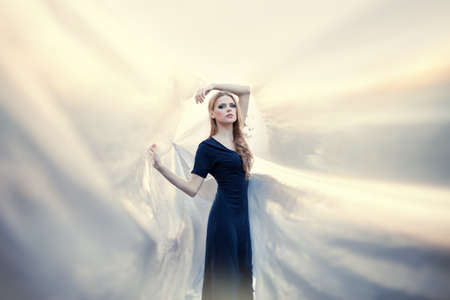 young beautiful girl on abstract background. Soft sunny colors