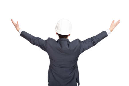 Engineer standing back view holding his arms up isolated on white backgroundの写真素材