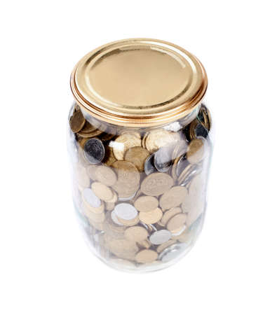Coins in the jar on white backgroundの写真素材