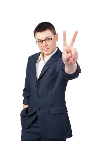 Portrait of young business man showing victory sign isolated on white backgroundの写真素材