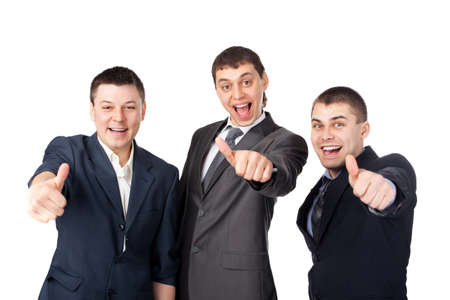 Three young  business men laughing and giving the thumbs up sign isolated on white backgroundの写真素材