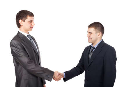 Young business men shaking hands isolated on white backgroundの写真素材