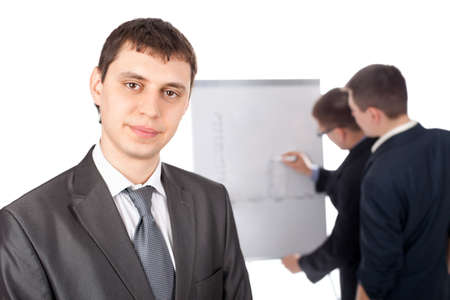 Group of businesspeople and a flipchart isolated on white backgroundの写真素材