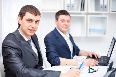 Two young business men working together at office の写真素材