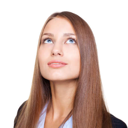 Closeup portrait of young businesswoman looking up isolated on white backgroundの写真素材