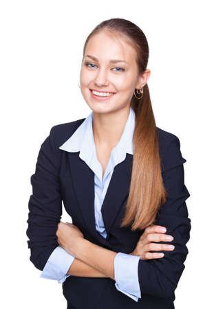 Portrait of young smiling businesswoman standing with hands folded against isolated on white backgroundの写真素材