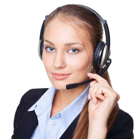 Closeup portrait of young female call centre employee with a headset on white backgroundの写真素材