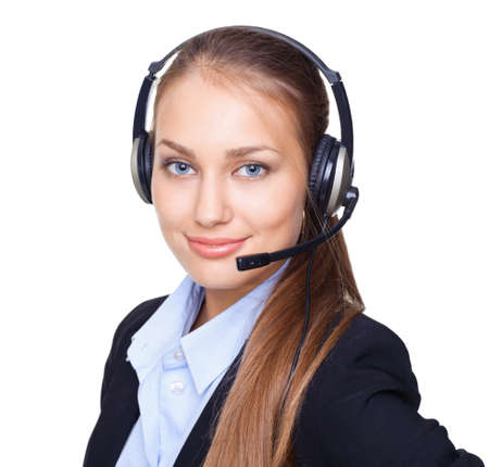 Closeup portrait of young female call centre employee with a headset on white backgroundの写真素材
