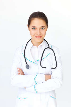 Portrait of young female doctor with arms crossedの写真素材
