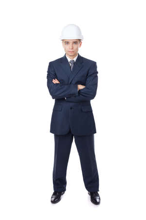 Engineer with white hard hat standing confidently isolated on white background の写真素材
