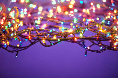 Christmas lights on dark blue background with copy space  Decorative garlandの写真素材