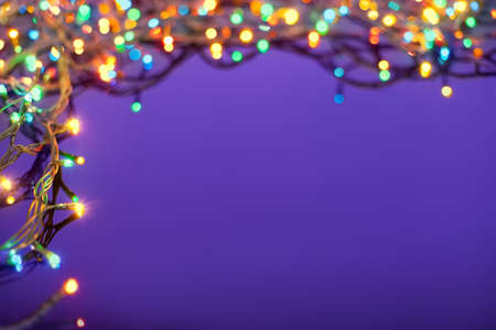 Christmas lights on dark blue background with copy space  Decorative garlandの写真素材