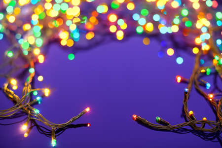 Christmas lights on dark blue background with copy space  Decorative garlandの写真素材