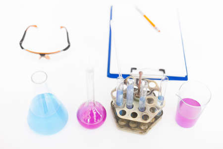 Chemical flasks with reagents on the tableの写真素材