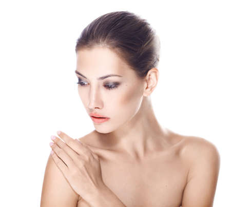 beautiful young woman with healthy face and clean skin isolated on white backgroundの写真素材