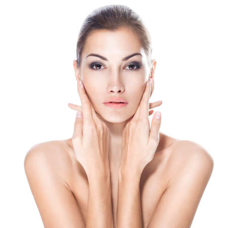beautiful young woman with healthy face and clean skin isolated on white backgroundの写真素材