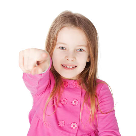 Cute little girl in red shirt pointing her finger isolated on white backgroundの写真素材