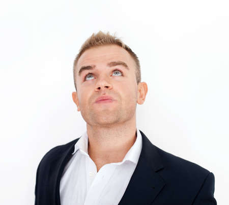 Thoughtful business man looking upwardの写真素材