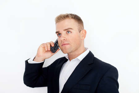 happy successful young business man talking on cell phone on white background