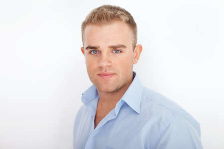 Closeup portrait of happy smiling young businessman on white backgroundの写真素材