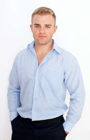Portrait of happy smiling young businessman on white backgroundの写真素材