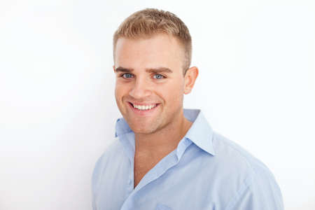Closeup portrait of happy smiling young businessman on white backgroundの写真素材