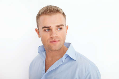 Closeup portrait of happy smiling young businessman on white backgroundの写真素材
