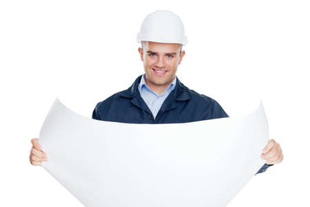 Young engineer looking at blueprint isolated on white background の写真素材
