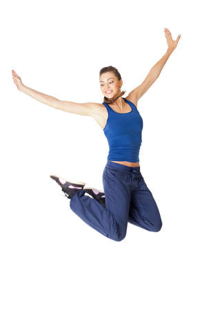 Young healthy fitness woman jump isolated on white backgroundの写真素材
