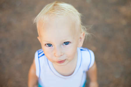 Portrait of a smiling little boy in the park