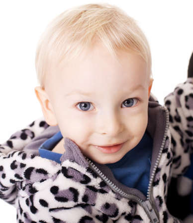 Portrait of cute little smiling boy isolated on white backgroundの写真素材